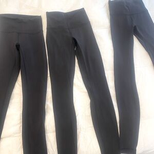 Lululemon wunder under THREE PAIRS. Black size 2. Worn a few times. No flaws.